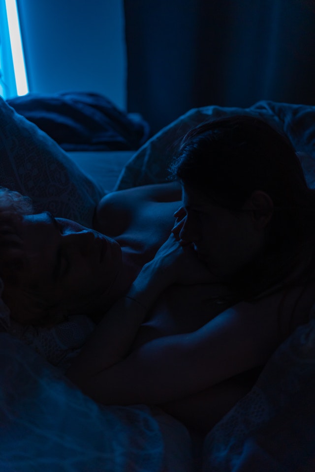 two men in bed